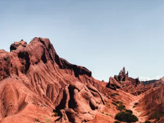 A red rock formation in the desert